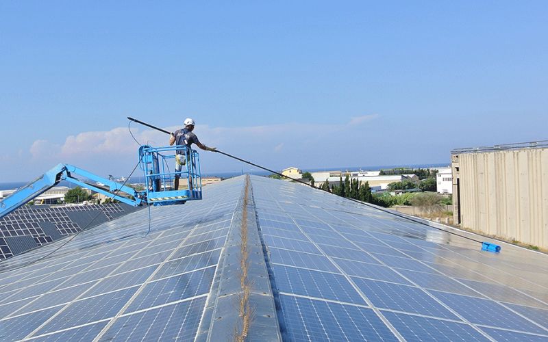 Roof mounted solar panel cleaning